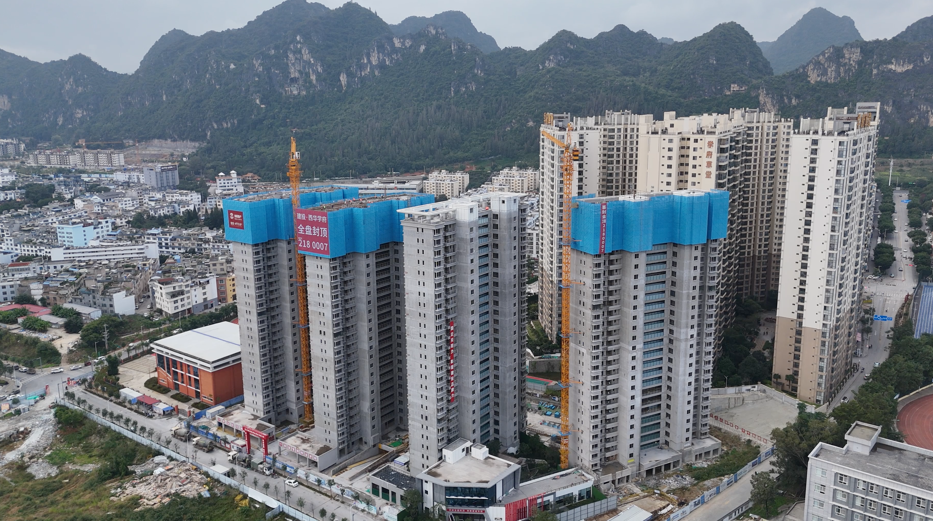 提前11天 建投·西華學府項目主體結(jié)構(gòu)全面封頂